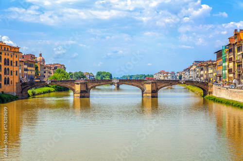Florence. City landscape. In the foreground the old medieval arched bridge - Ponte Santa Trinita.