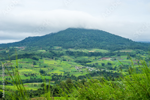 Aerial view of hills in rural covered with fog in the morning