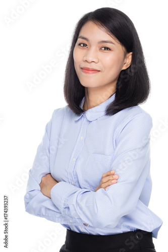 Portrait of a beautiful asian business woman with arms folded. Isolated on white background