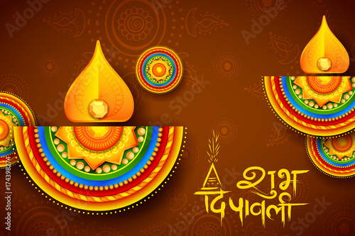Burning diya on Diwali Holiday background for light festival of India with message in Hindi meaning Happy Dipawali