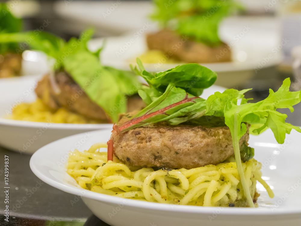 Many hamburg steak serve with noodle and vegetable Many hamburg steak serve with noodle and vegetable