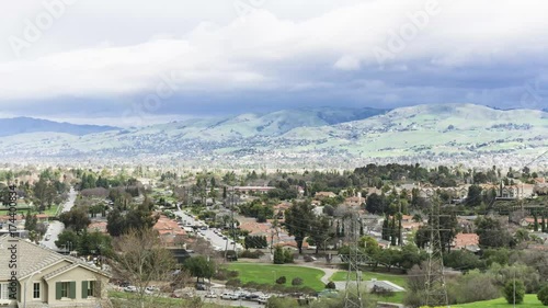 Timelapse: Storm clouds move in over the east hills of San Jose, California in spring. photo