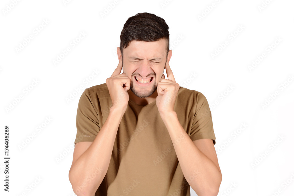 Man covering his ears. Man covering his ears.