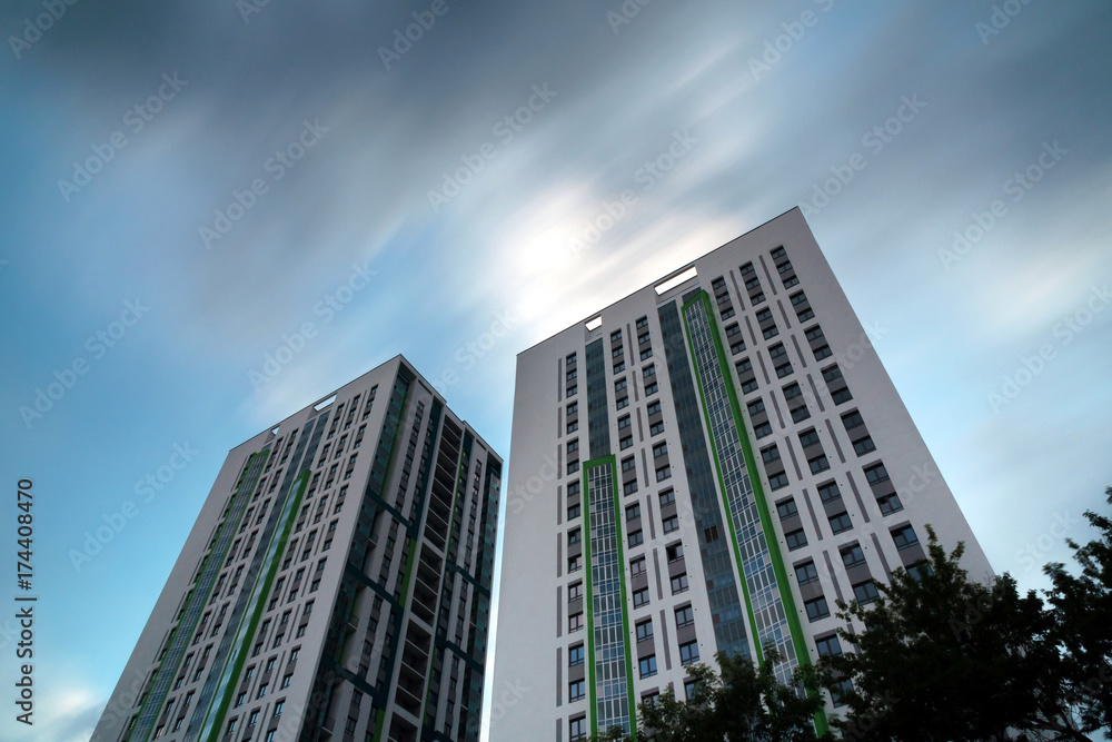 two buildings as two towers amid flying clouds two buildings as two towers amid flying clouds