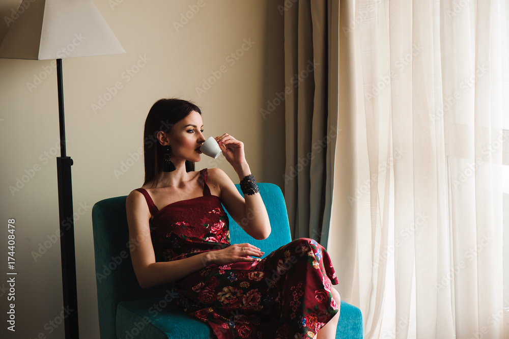 Young beautiful woman drinking coffe at home Young beautiful woman drinking coffe at home