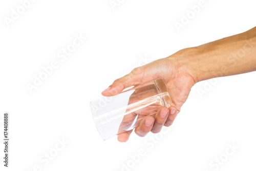 Hand holding empty glass like a pouring water isolated on white background with clipping path.