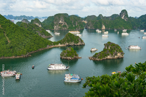 Halong bay mountain islands with cruise boats © Olga K