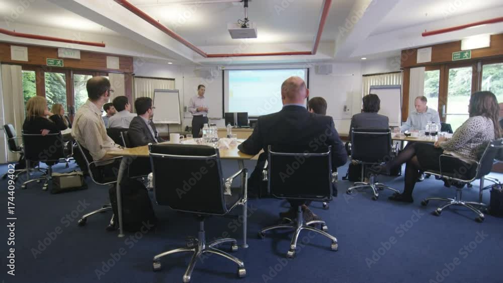  Real business group listening to the speaker at a business seminar