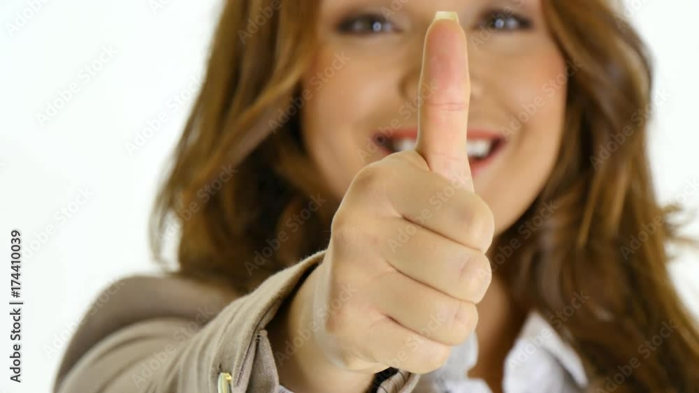 Happy businesswoman giving thumbs up. Happy businesswoman giving thumbs up.