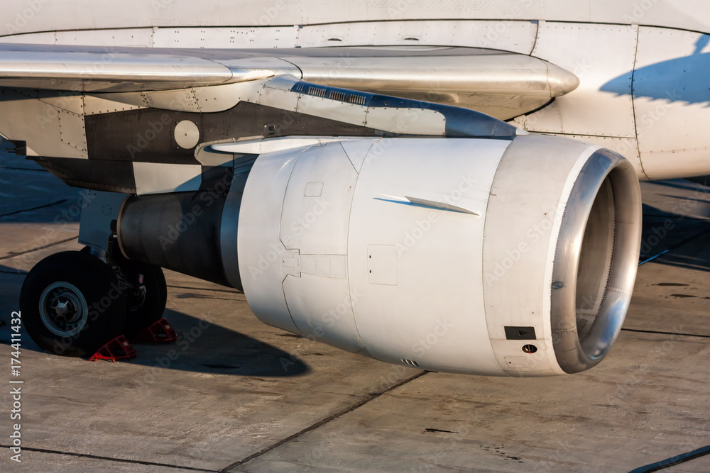 Close-up of engine and main landing gear of passenger aircraft Close-up of engine and main landing gear of passenger aircraft