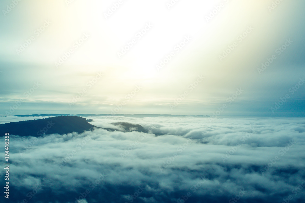 Fototapeta premium Sea of mist and early morning sunrise background