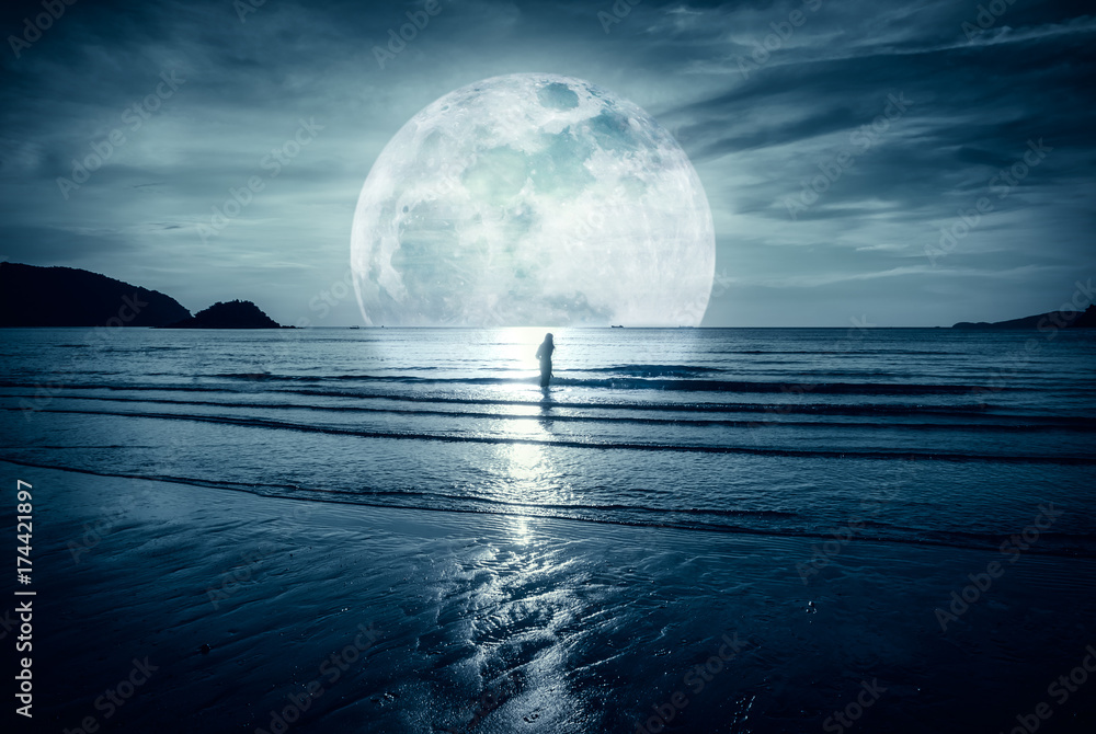 Super moon. Colorful sky with cloud and bright full moon over seascape.
