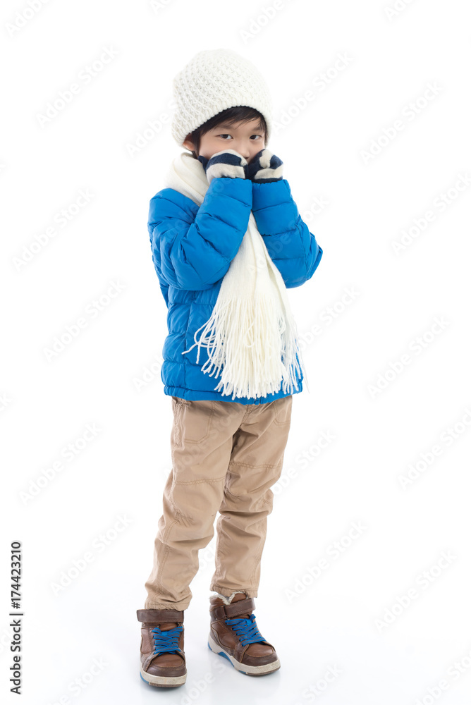 Happy asian child in winter clothes