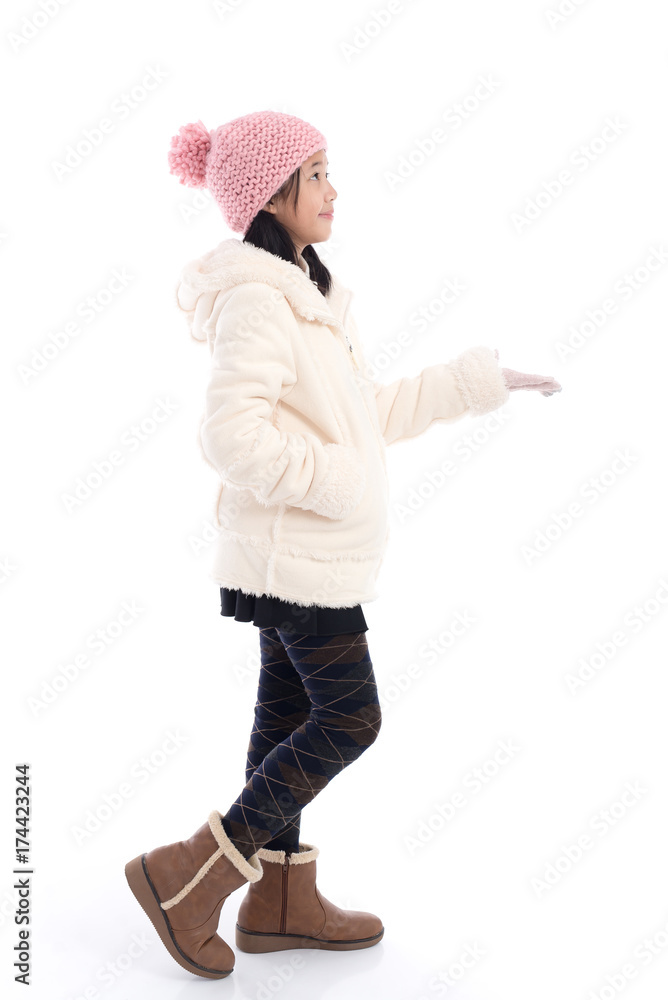 Naklejka premium Cute Asian child in blue winter clothes open palm hand
