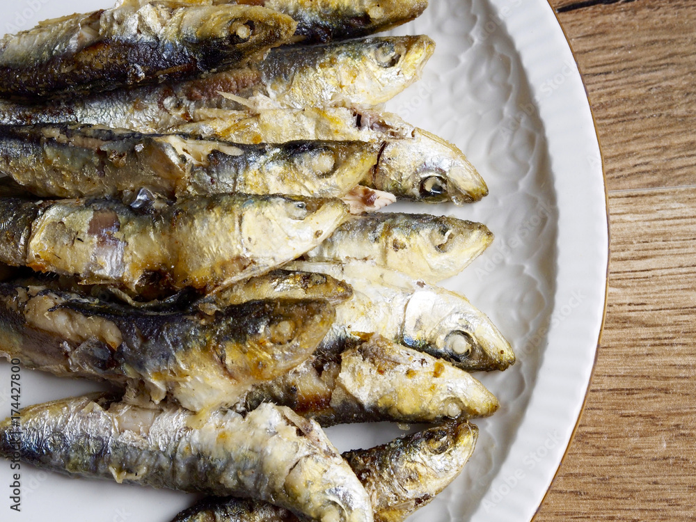 Fried small sardine on a plate Fried small sardine on a plate