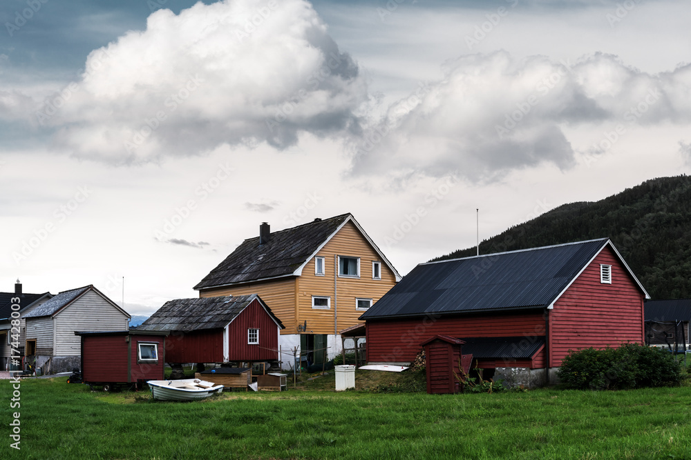 Fototapeta premium Red house near Steinsdalsfossen waterfall