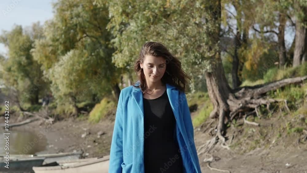 Beautiful girl walking through the autumn forest Beautiful girl walking through the autumn forest