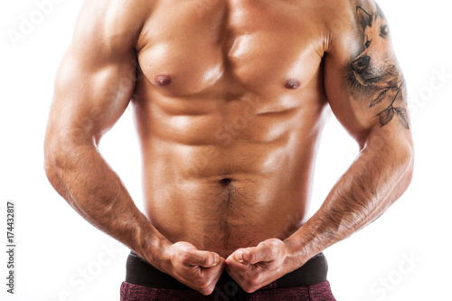 Shot of muscular fitness model posing shirtless