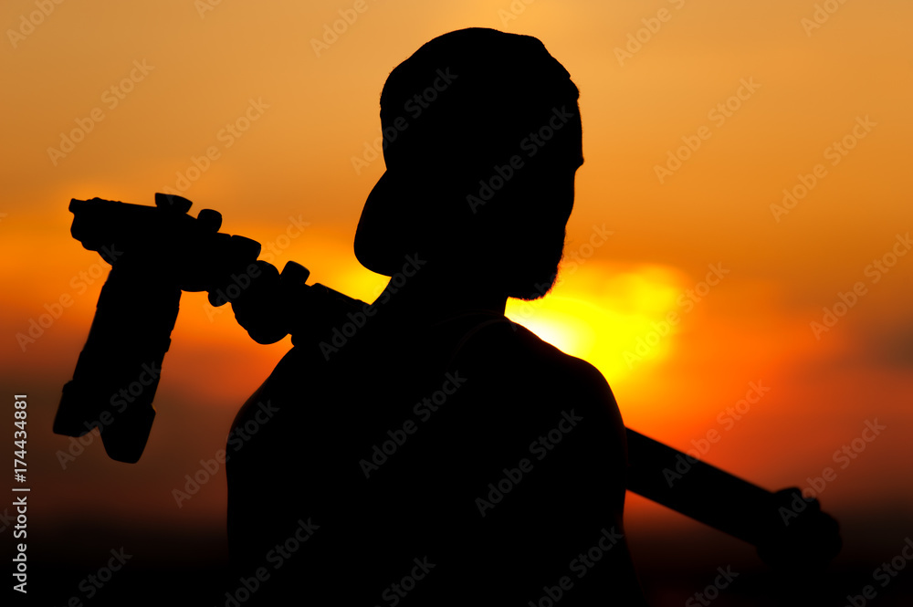Silhouette of male photographer taking pictures