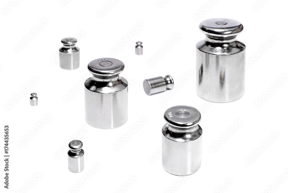 Metallic weights for scales on white background Metallic weights for scales on white background