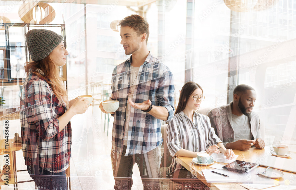 Fototapeta premium Excited friends having interesting talk