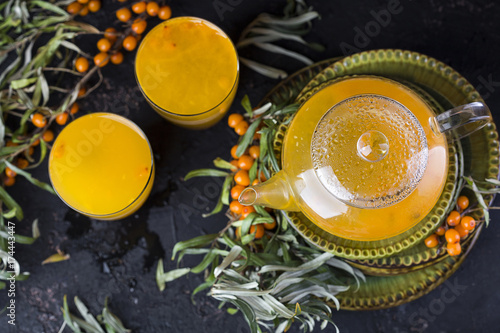 Wallpaper Mural tea with sea-buckthorn on a black background Torontodigital.ca