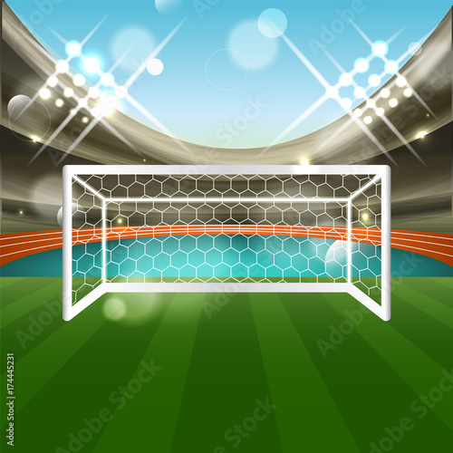 Football stadium with soccer goal net, grass and athletic track. Tribune, glitter and spotlights.
