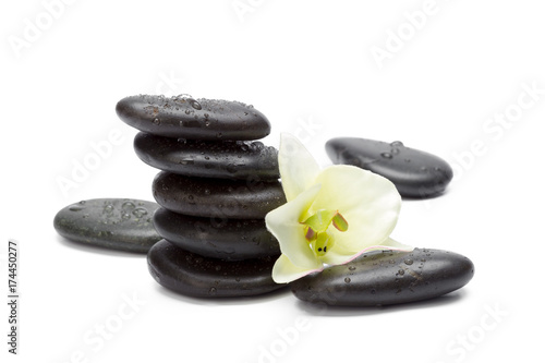 Spa stones and orchid flowers  isolated on white.