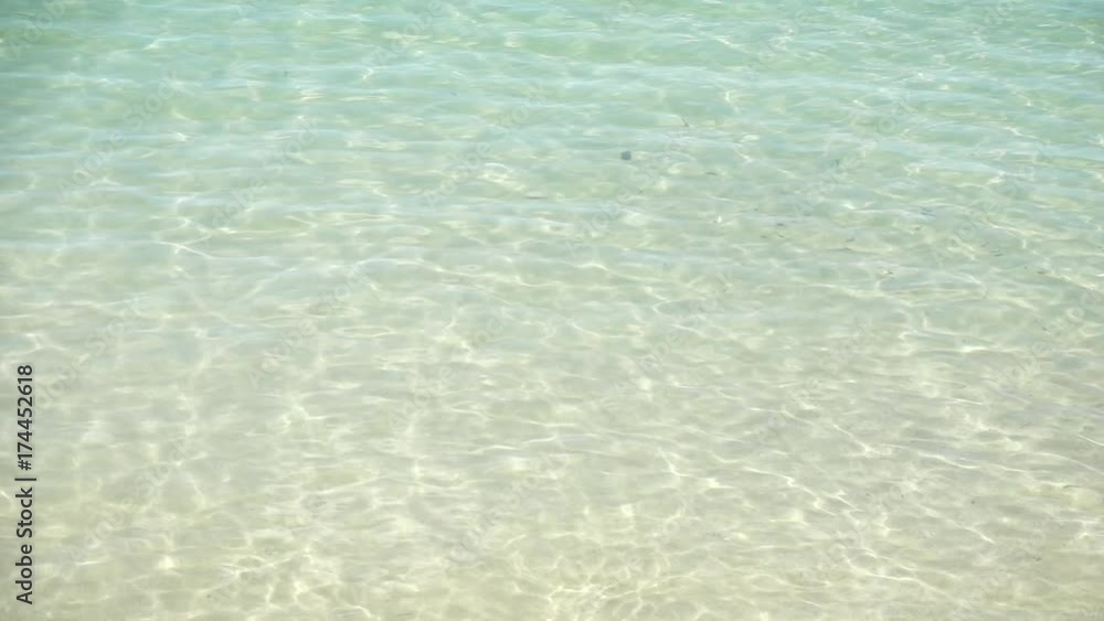 sand and waves splashing the beach,crystal clear water. sand and waves splashing the beach,crystal clear water.