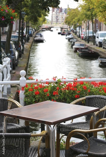 Photography alfresco table of a bar and canal