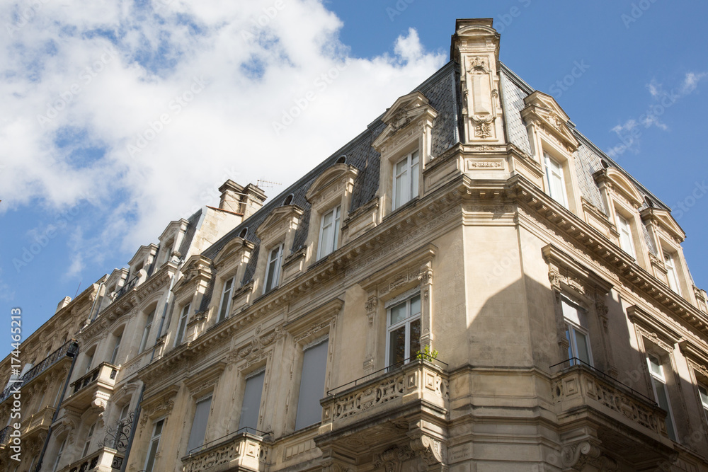 Facade of a traditional apartment building in Paris, France