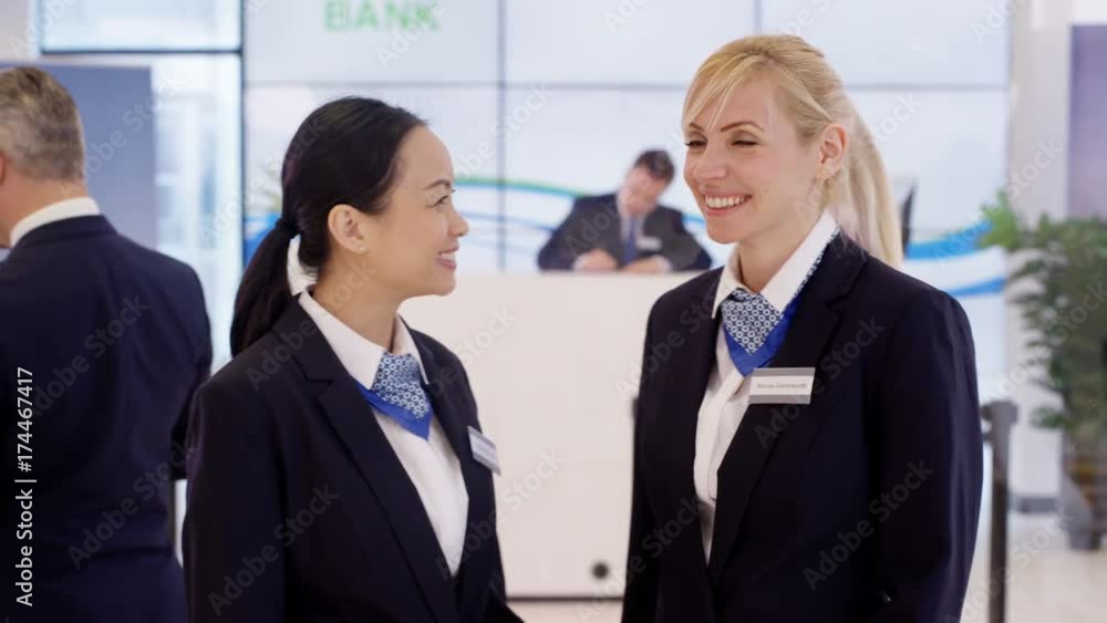 Portrait of friendly smiling customer service staff at work in bank Portrait of friendly smiling customer service staff at work in bank