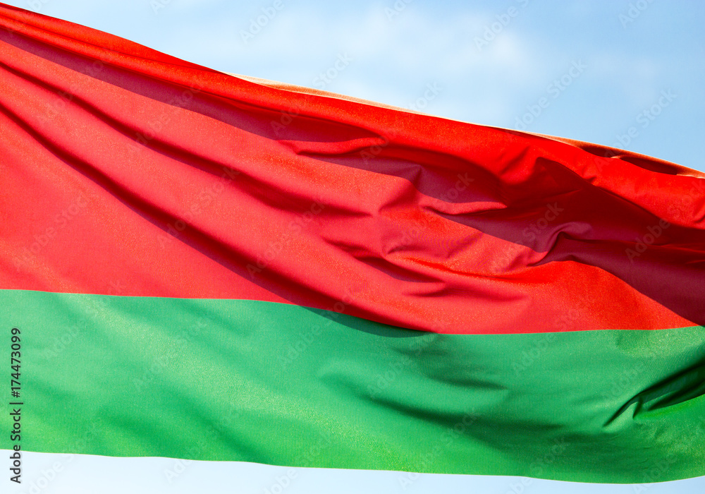Naklejka premium Flag of Belarus against the blue sky