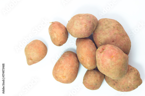 Organic food concept top view fresh red potatoes on white background with copy space