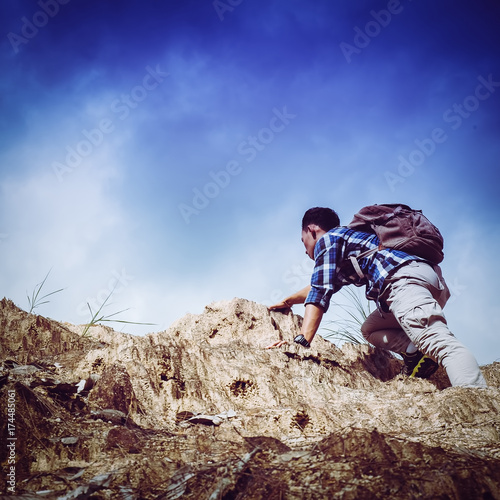Man Climbing the mountain to find his challenge/The climbing man