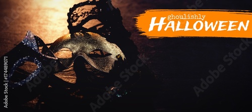 Composite image of graphic image of ghoulishly halloween text photo