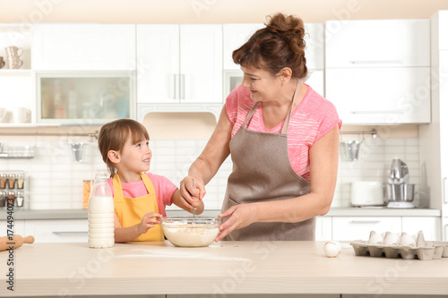 Cute little girl and her gr...