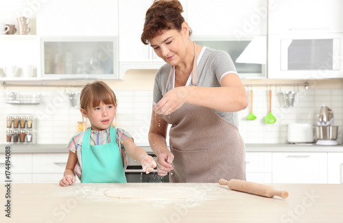 Cute little girl and her gr...