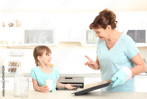 Cute little girl and her gr...