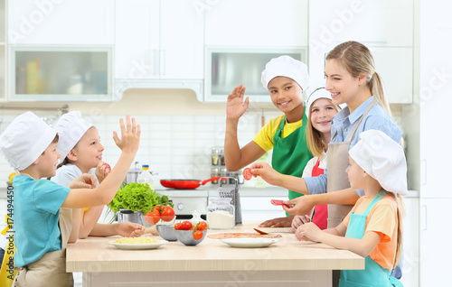 Group of children and teach...