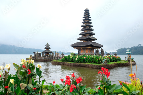 Pura Ulun Danu Bratan, a Hindu temple surrounded by flowers on Bratan lake, one of famous tourist attraction in Bali, Indonesia