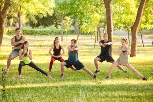 Group of young people stretching outdoors
