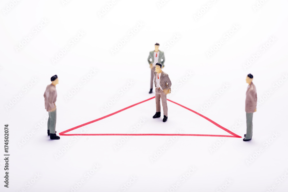 Miniature business people in conection scheme over white backdrop or background. Miniature business people in conection scheme over white backdrop or background.