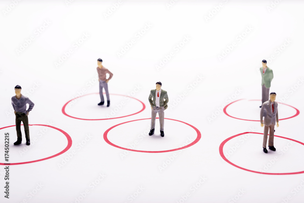 Miniature business people in conection scheme over white backdrop or background. Miniature business people in conection scheme over white backdrop or background.