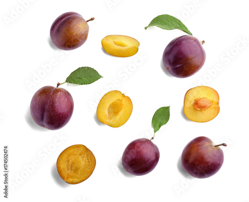 Fresh ripe plums on white background