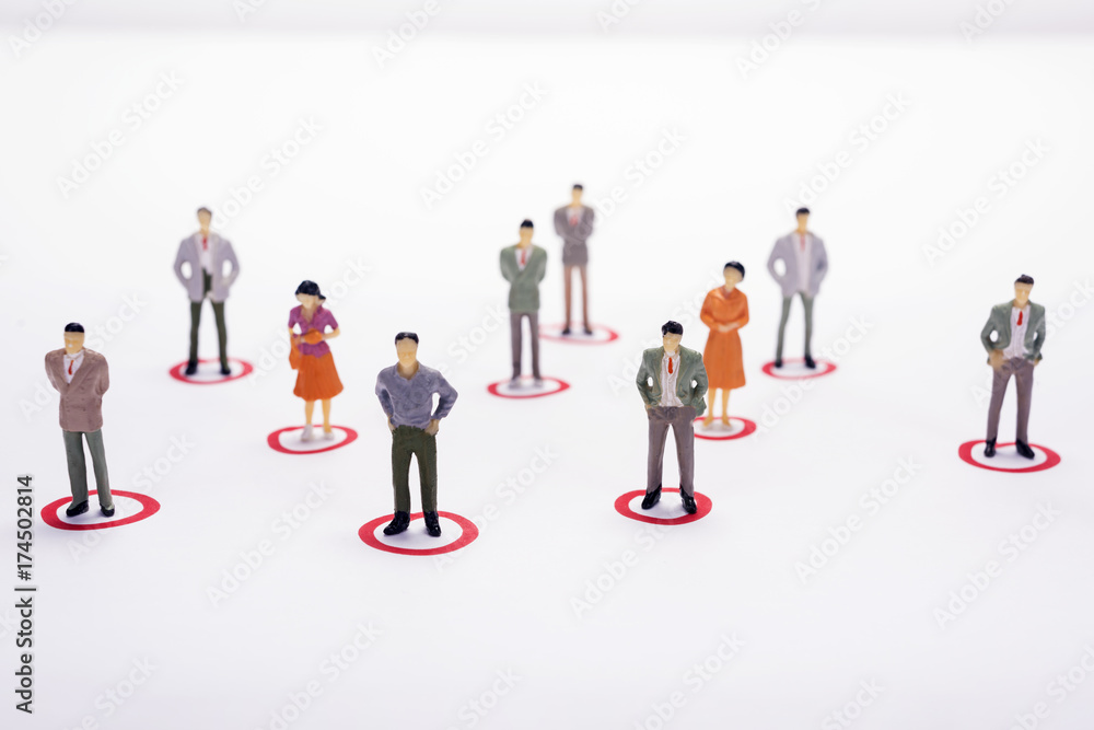 Miniature business people in conection scheme over white backdrop or background.