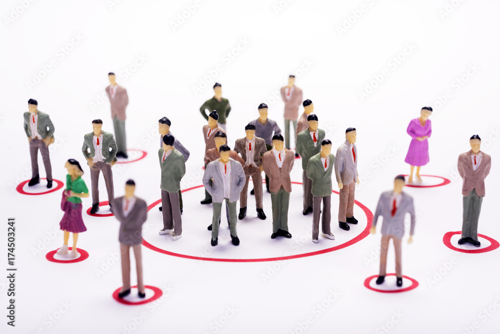 Miniature business people in conection scheme over white backdrop or background. Miniature business people in conection scheme over white backdrop or background.