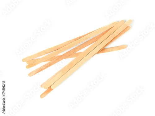 Fotografie Wooden coffee stirrers on white background