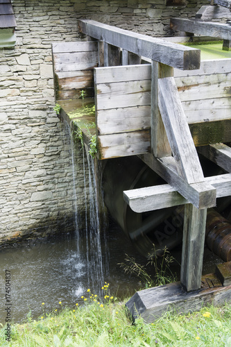 A rotating wooden cascade water wheel.