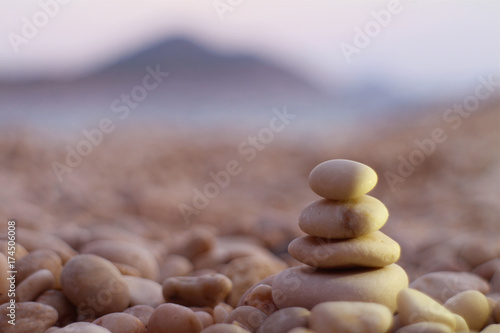 Canvas Print Stacked stones on a beach